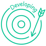 Étampe pour enseignant en anglais « Developing » avec cible et flèche en progression - encre verte